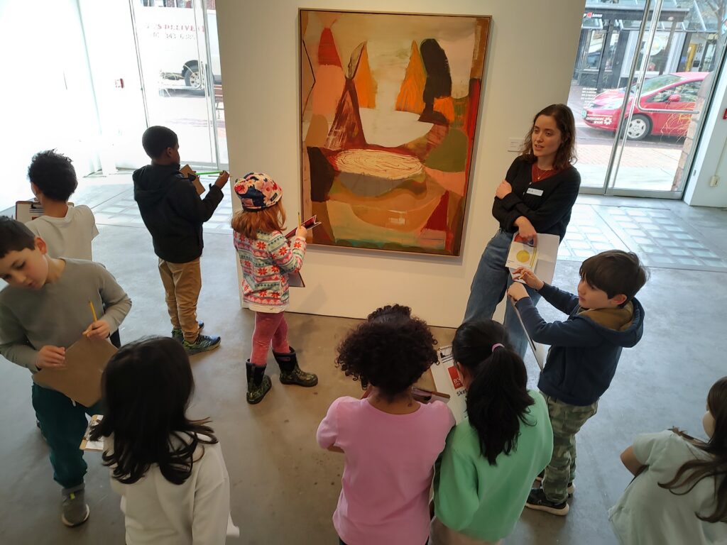 Students having a gallery tour at Burlington City Arts Gallery.