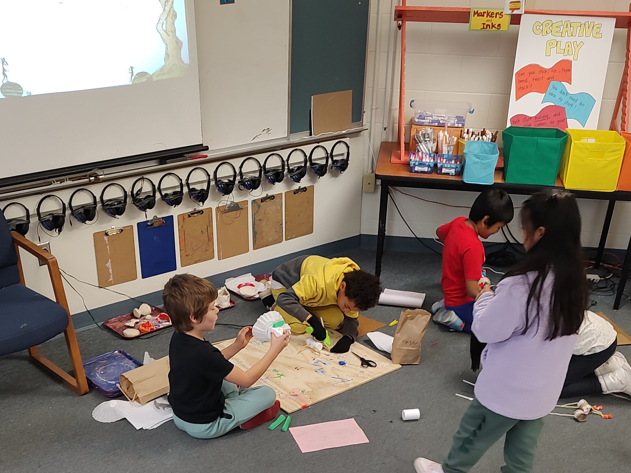 students at building puppets