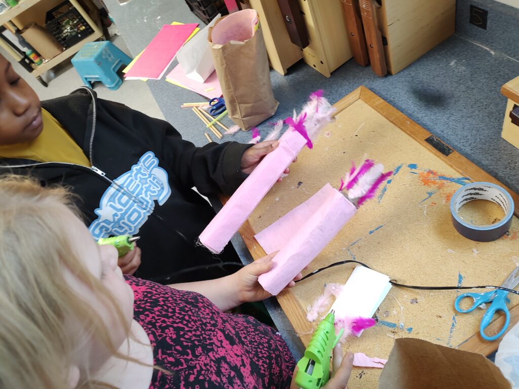 3rd grade building puppets for our EFS weather puppet show.