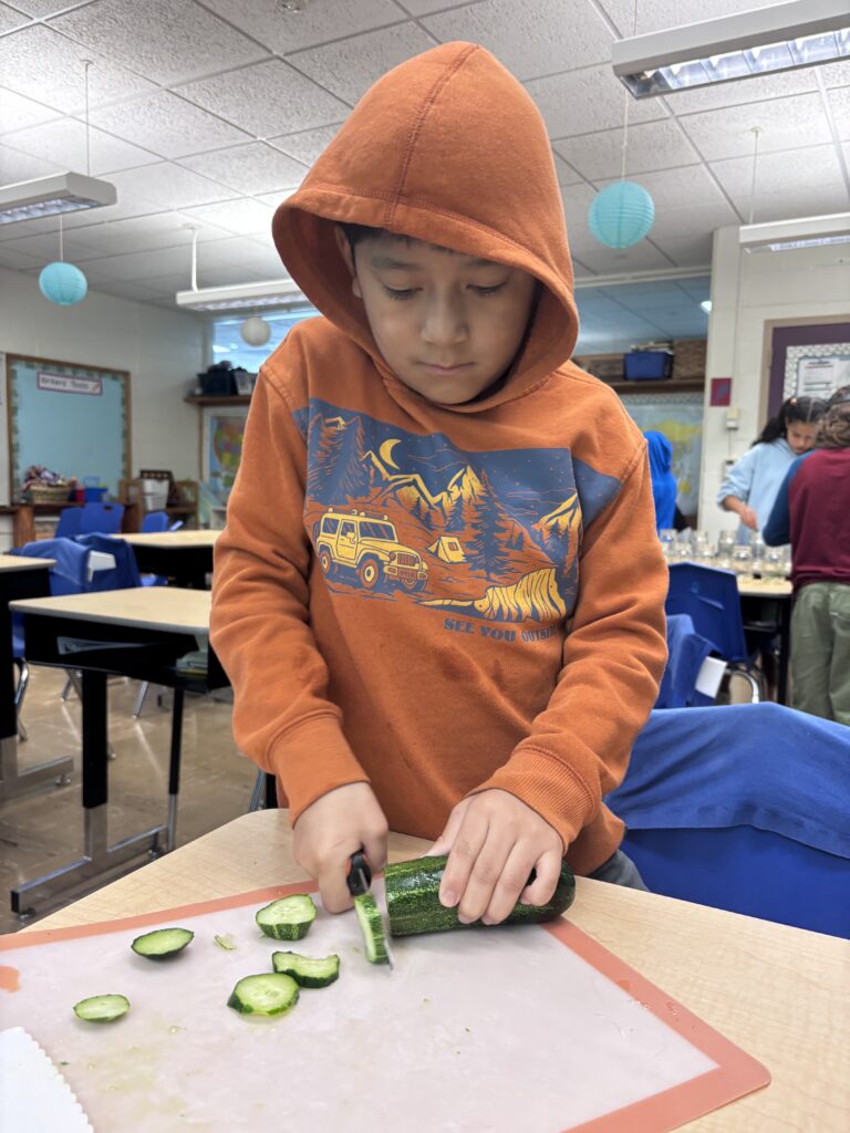 Student Cutting Cucumbers